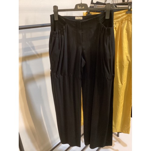 164 - A quantity of trousers and skirts to include ISABEL MARANT yellow parachute trousers and blue woven ... 