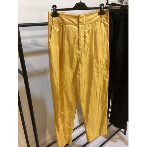 164 - A quantity of trousers and skirts to include ISABEL MARANT yellow parachute trousers and blue woven ... 