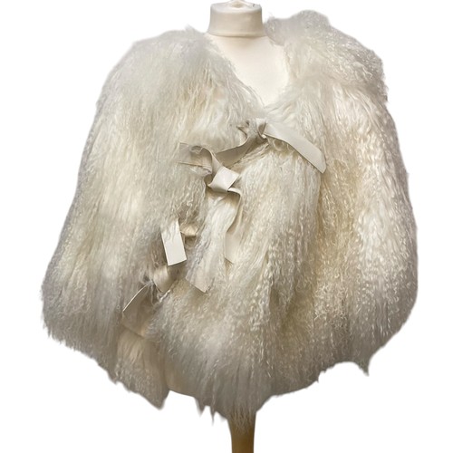 171 - A goat hair style cream wrap cape, EMPORIO ARMANI short fur stole, KARL DONOGHUE black leather and f... 