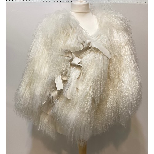 171 - A goat hair style cream wrap cape, EMPORIO ARMANI short fur stole, KARL DONOGHUE black leather and f... 