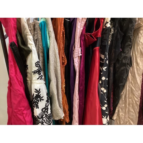 180 - A quantity of dresses 29 items, strapless/prom/ball/party dresses. Some worn, some never worn. Sizes... 