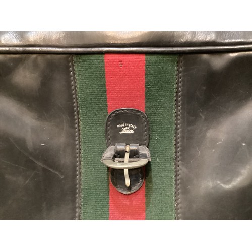 72 - Two pieces of Gucci luggage: a small black suitcase, stamped PEW, initials to handle, with iconic gr... 