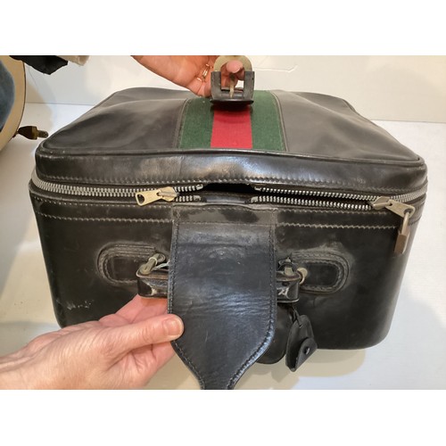 72 - Two pieces of Gucci luggage: a small black suitcase, stamped PEW, initials to handle, with iconic gr... 