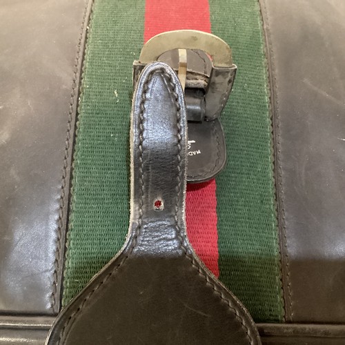 72 - Two pieces of Gucci luggage: a small black suitcase, stamped PEW, initials to handle, with iconic gr... 