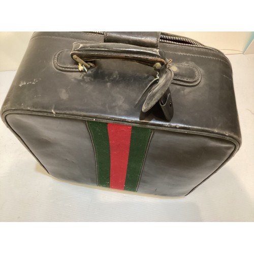 72 - Two pieces of Gucci luggage: a small black suitcase, stamped PEW, initials to handle, with iconic gr... 