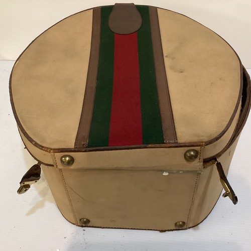 72 - Two pieces of Gucci luggage: a small black suitcase, stamped PEW, initials to handle, with iconic gr... 