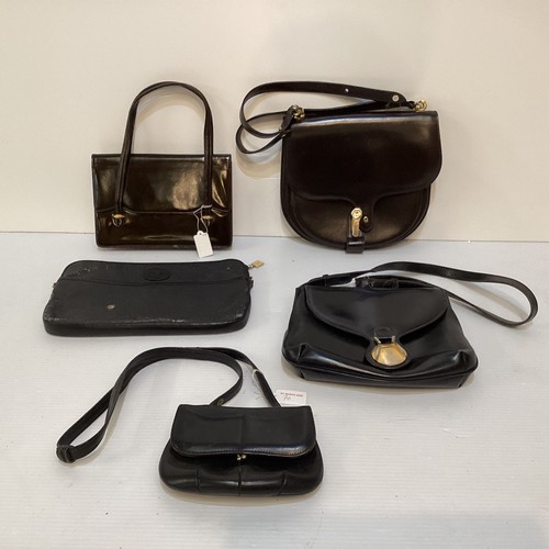 70 - A quantity of early GUCCI handbags and purses, in brown and black leather, some with wear, see all p... 