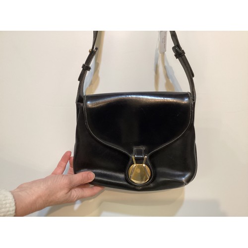 70 - A quantity of early GUCCI handbags and purses, in brown and black leather, some with wear, see all p... 