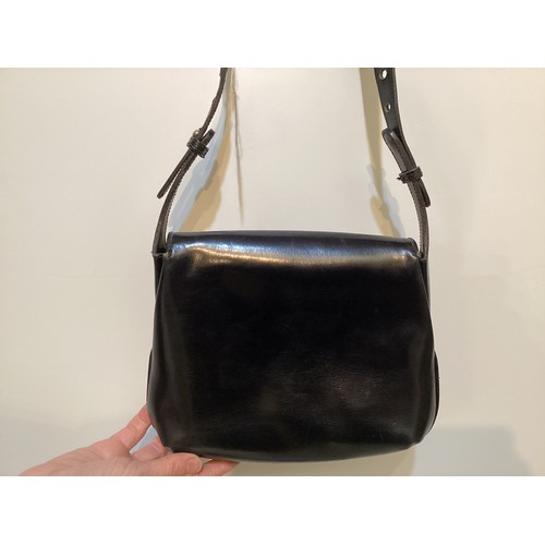 70 - A quantity of early GUCCI handbags and purses, in brown and black leather, some with wear, see all p... 