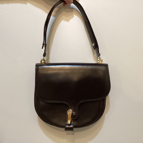 70 - A quantity of early GUCCI handbags and purses, in brown and black leather, some with wear, see all p... 