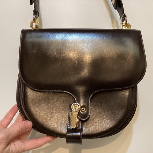 70 - A quantity of early GUCCI handbags and purses, in brown and black leather, some with wear, see all p... 