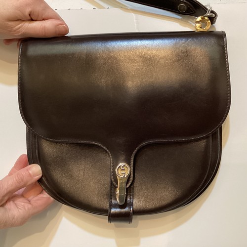 70 - A quantity of early GUCCI handbags and purses, in brown and black leather, some with wear, see all p... 