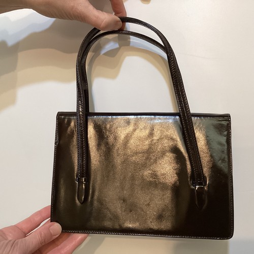 70 - A quantity of early GUCCI handbags and purses, in brown and black leather, some with wear, see all p... 