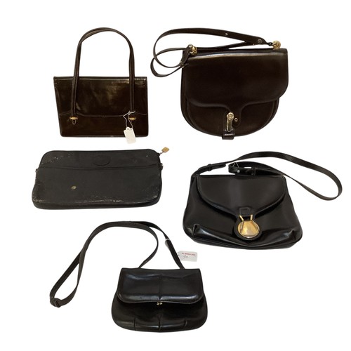 70 - A quantity of early GUCCI handbags and purses, in brown and black leather, some with wear, see all p... 