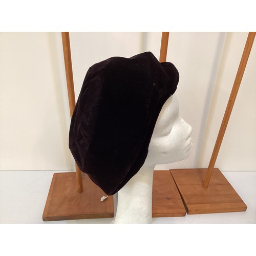 76 - Three GIVENCHY, Paris hats circa 1960's, to include black leather, a pink silk with Chanel style flo... 