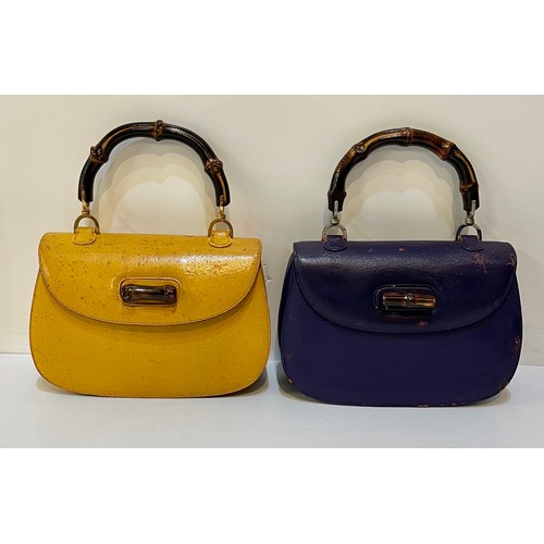 71 - Two GUCCI leather handbags with bamboo handle and fastening. Yellow with Gucci metal zip pull and nu... 