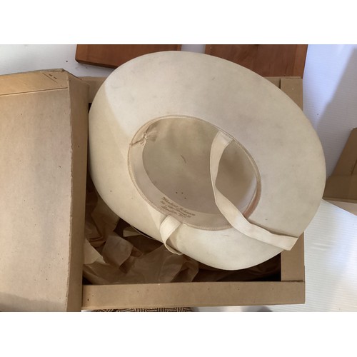 75 - A quantity of hats, to include two HERBERT JOHNSTON felt hats in original boxes, and a fine parasisa... 