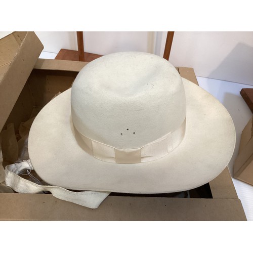 75 - A quantity of hats, to include two HERBERT JOHNSTON felt hats in original boxes, and a fine parasisa... 