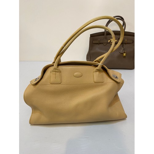 183 - Two leather handbags, TOD'S cream leather condition some marks, and another brown designer style.