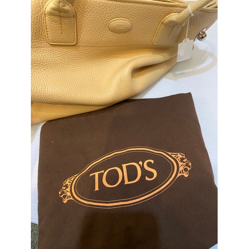 183 - Two leather handbags, TOD'S cream leather condition some marks, and another brown designer style.