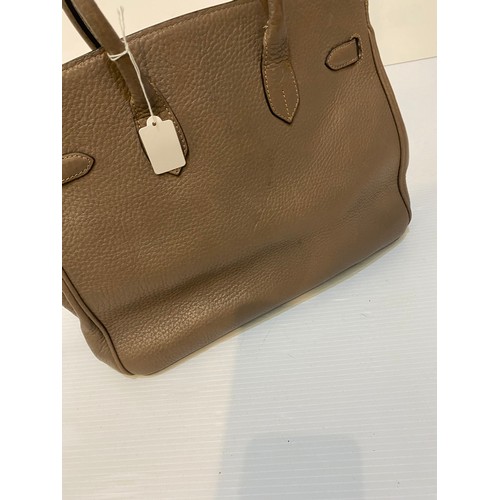 183 - Two leather handbags, TOD'S cream leather condition some marks, and another brown designer style.