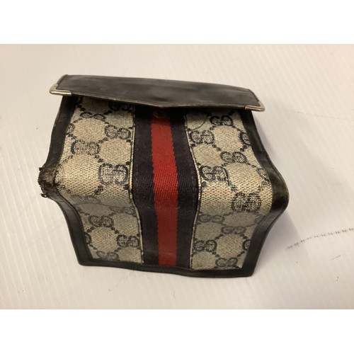 143 - GUCCI, a Gucci handbag and purse, with Gucci motif and traditional blue red ribbon stripe, cross bod... 