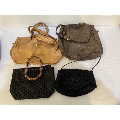 148 - A large quantity of handbags and belts. Clearance. sold as seen. See all photos.