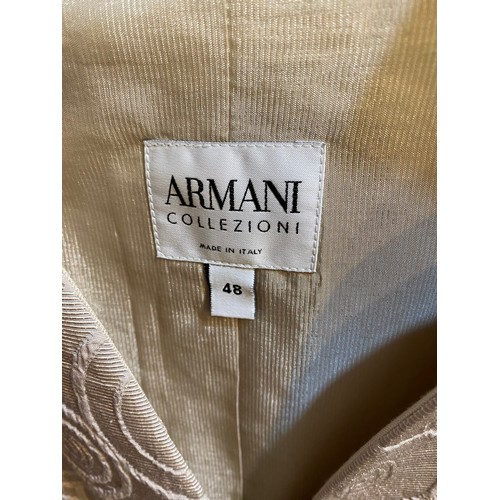 196 - A quantity of clothes to include an ARMANI suit, MAX MARA skirt, 3 further suits and a jacket.