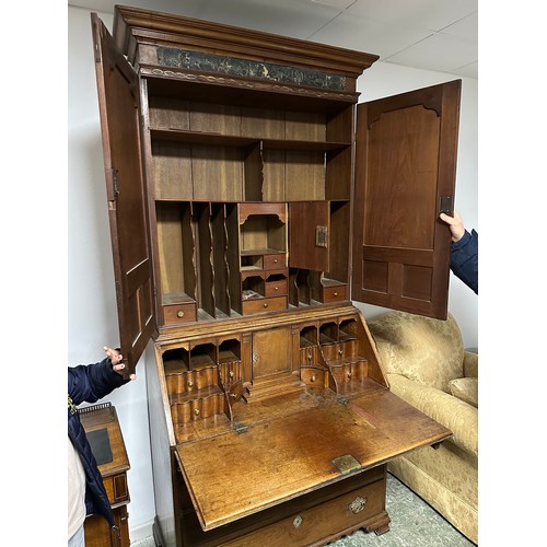 618 - A bureau book case, the top opening to reveal a fitted stationery interior, with brass drop handles,... 