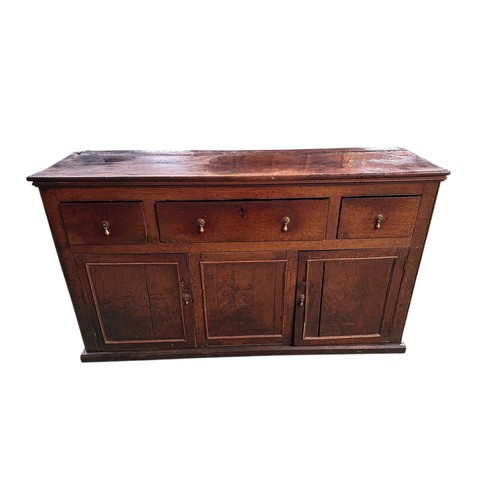 634 - A heavy oak sideboard base with three drawers above 3 cupboards below