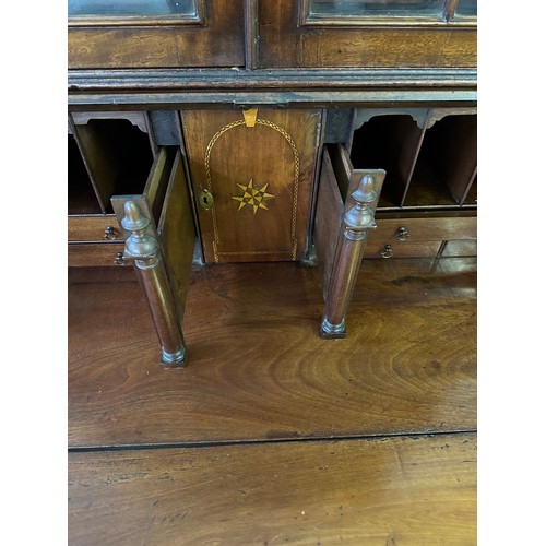 640 - A George III mahogany bureau bookcase, the fall front revealing fitted interior, over 4 long graduat... 