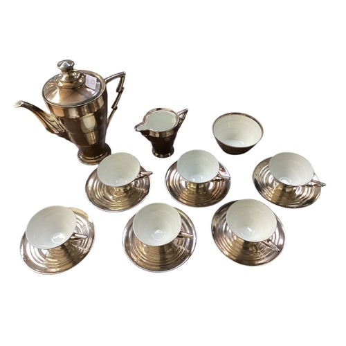 428 - A Sterling silver on porcelain 6 tea cup and saucers and milk and coffee, in the Art Deco taste, som... 