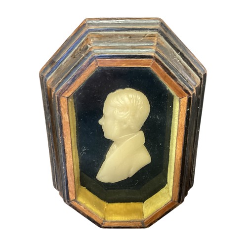 440 - A collection of framed and glazed miniature wax portraits.