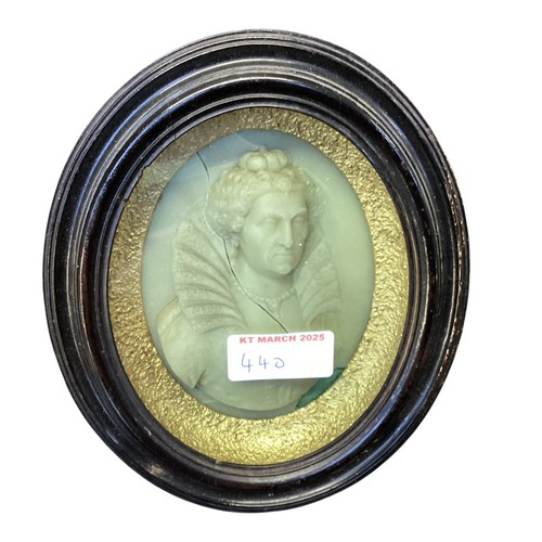 440 - A collection of framed and glazed miniature wax portraits.