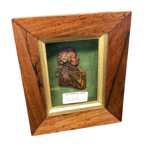 440 - A collection of framed and glazed miniature wax portraits.