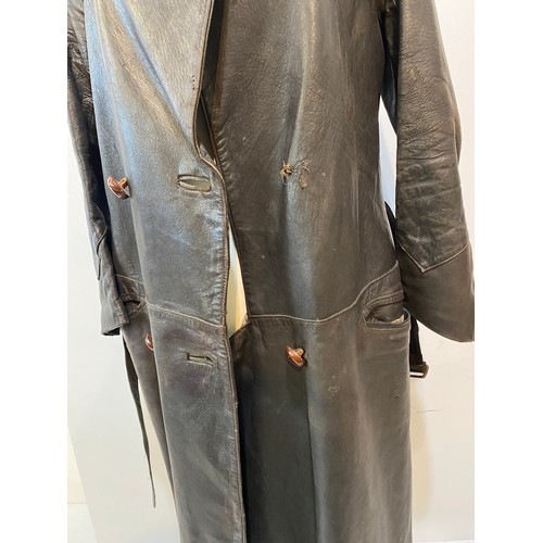 216 - Long brown leather coat with belt. Inside armpit to armpit 43cm, length 122cm. Vintage been worn ass... 