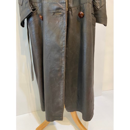 216 - Long brown leather coat with belt. Inside armpit to armpit 43cm, length 122cm. Vintage been worn ass... 