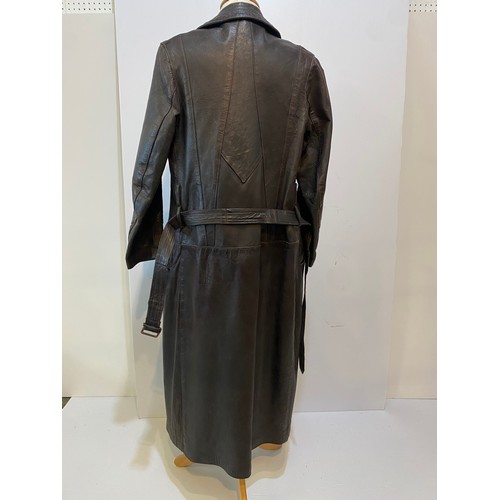 216 - Long brown leather coat with belt. Inside armpit to armpit 43cm, length 122cm. Vintage been worn ass... 