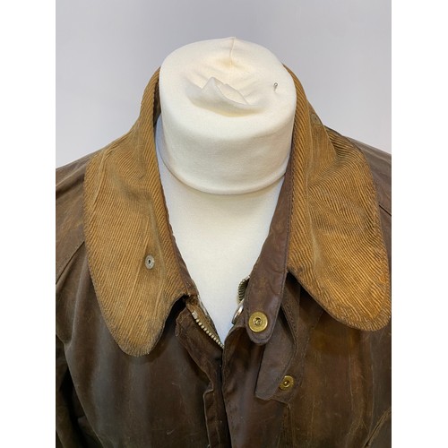 217 - BARBOUR coat. Worn with some ware marks, with belt, hole in lining. Inside armpit to armpit 65cm, le... 