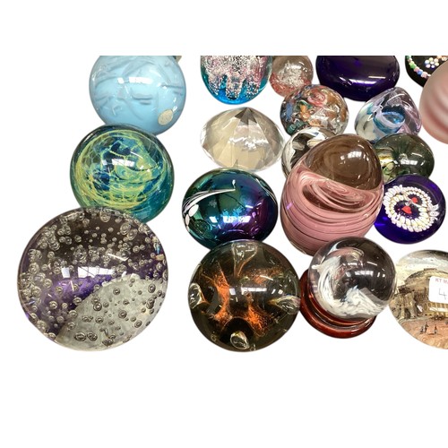 435 - A large collection of glass paperweights, including Caithness,  Perthshire, etc.