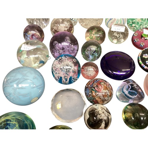 435 - A large collection of glass paperweights, including Caithness,  Perthshire, etc.