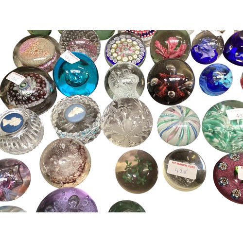 435 - A large collection of glass paperweights, including Caithness,  Perthshire, etc.