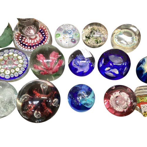 435 - A large collection of glass paperweights, including Caithness,  Perthshire, etc.