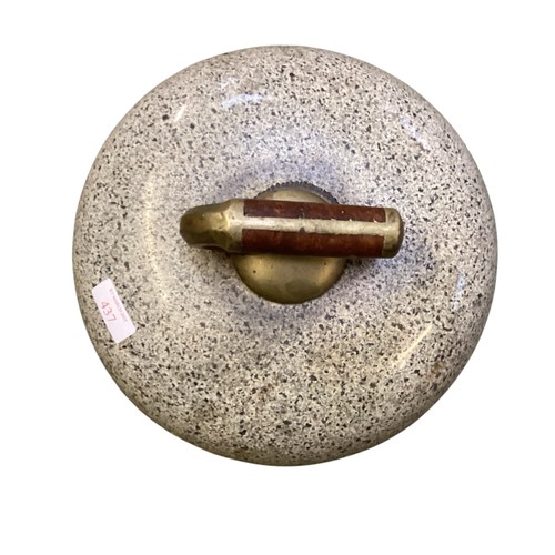 437 - A Curling stone, 26cm diameter approx.