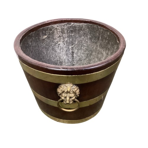 408 - An Irish brass bound mahogany peat bucket, with lion mask handles.