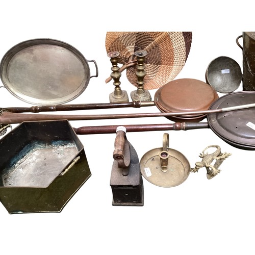 443 - A quantity of brass and copper wares to include bed warming pans, coalscuttle, brass candlesticks, c... 