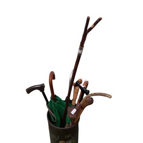 442 - A decorative floral stick stand, with a quantity of sticks.