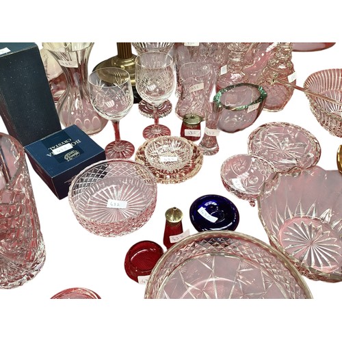 432 - A quantity of glass decanters, vases etc.  please note this is not pink glass, it is clear.  photos ... 