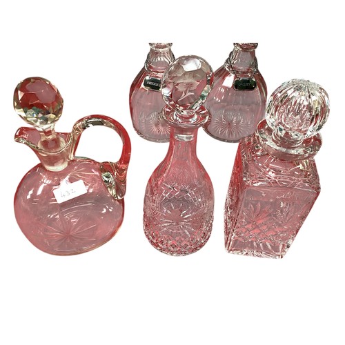 432 - A quantity of glass decanters, vases etc.  please note this is not pink glass, it is clear.  photos ... 