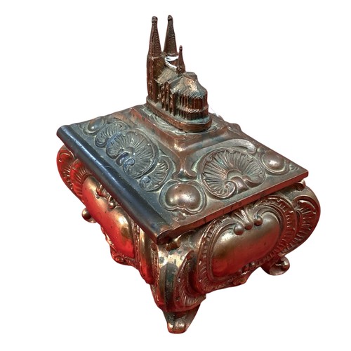 417 - A Continental copper decorative music box, with church finial, much wear and rubbing.